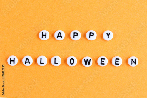 The inscription Happy Halloween on an orange background. Beautiful holiday inscription