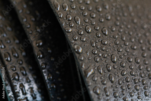 Water droplets on the rubber membrane. Waterproofing...  Close-up selective focus area.