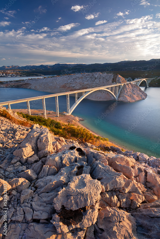 Krk Bridge, Croatia. Image of Krk Bridge which connects the Croatian island of Krk with the mainland at beautiful summer sunrise.