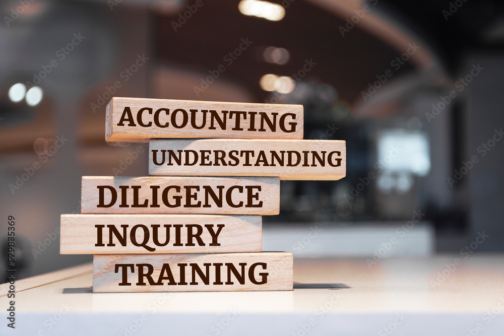 Fototapeta premium Wooden blocks with words 'Accounting, Understanding, Diligence, Inquiry, Training'.