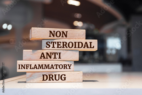 Wooden blocks with words 'Nonsteroidal anti-inflammatory drug'. photo