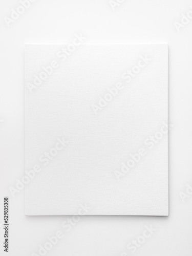 empty white canvas on a white table. space for text, template for design