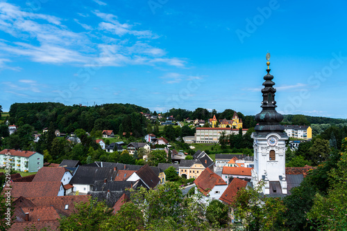 Beautiful aerial view of Ehrenhausen town with the clock tower of the Catholic pilgrimage church in foreground, Leibnitz, south Styria, Austria photo