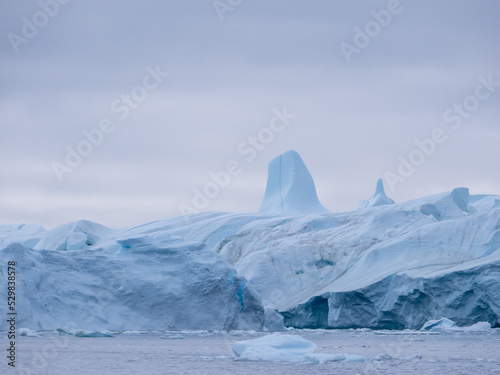 Awe-inspiring icy landscapes at the mouth of the Icefjord glacier (Sermeq Kujalleq), one of the fastest and most active glaciers in the world. Disko Bay, Ilulissat, Greenland