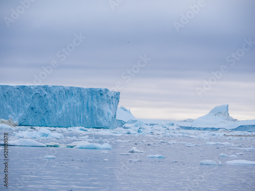 Awe-inspiring icy landscapes at the mouth of the Icefjord glacier (Sermeq Kujalleq), one of the fastest and most active glaciers in the world. Disko Bay, Ilulissat, Greenland © Luis