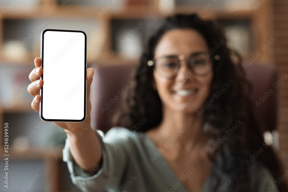 Modern smartphone with white blank screen in female hand