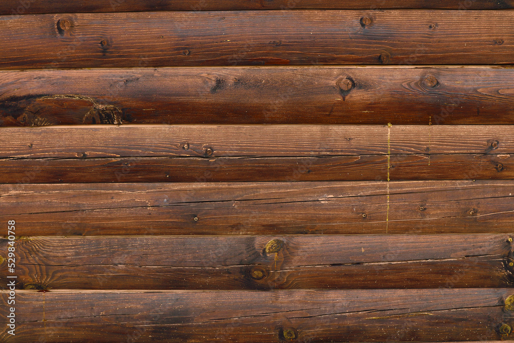 Fototapeta premium Wooden background. Wall made of wooden beams.