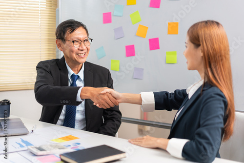 Business partnership concept, Two business people is shaking hand after make agreements together