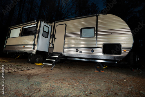 Long camping trailer at night © Guy Sagi