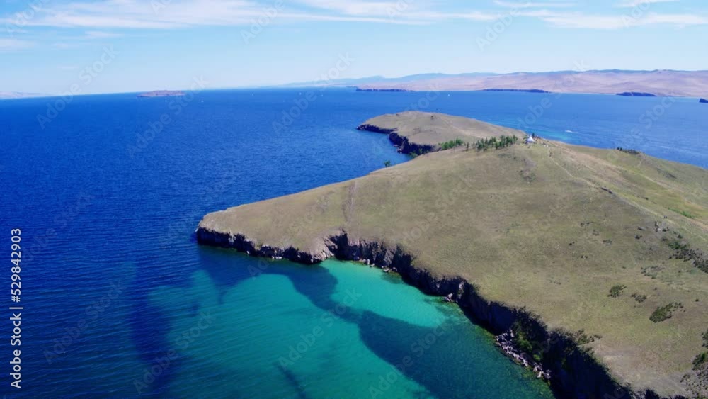 Ogoy Island with a Buddhist Stupa of Enlightenment on Lake Baikal in Siberia. Shooting from a drone Ogoy Island with a Buddhist Stupa of Enlightenment on Lake Baikal in Siberia. Shooting from a drone
