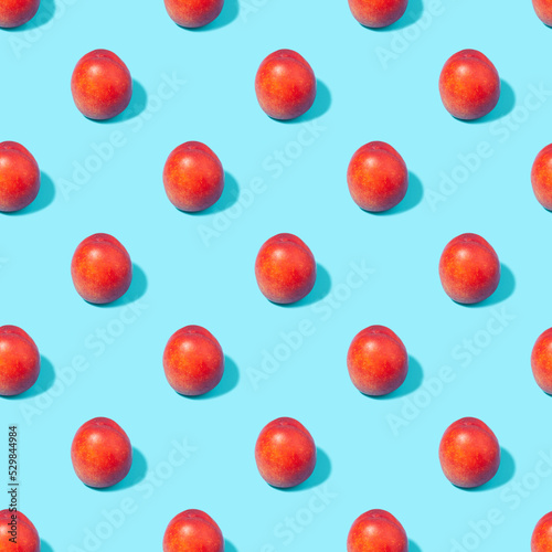 Seamless pattern with tropical fruits on a blue background