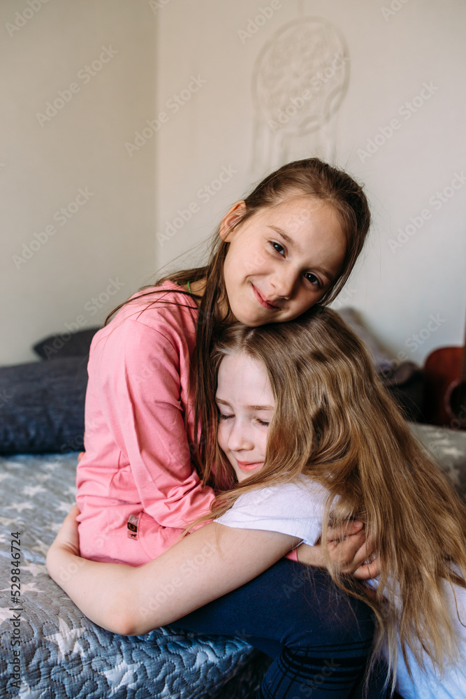 Two girls friends play at home after school, have fun Two girls friends play at home after school, have fun