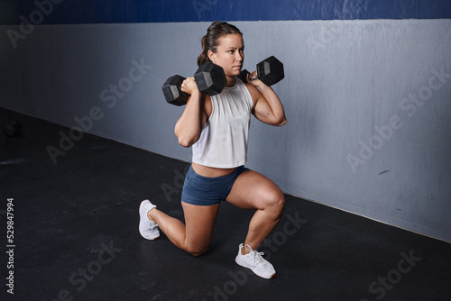 woman front rack dumbbell lunge