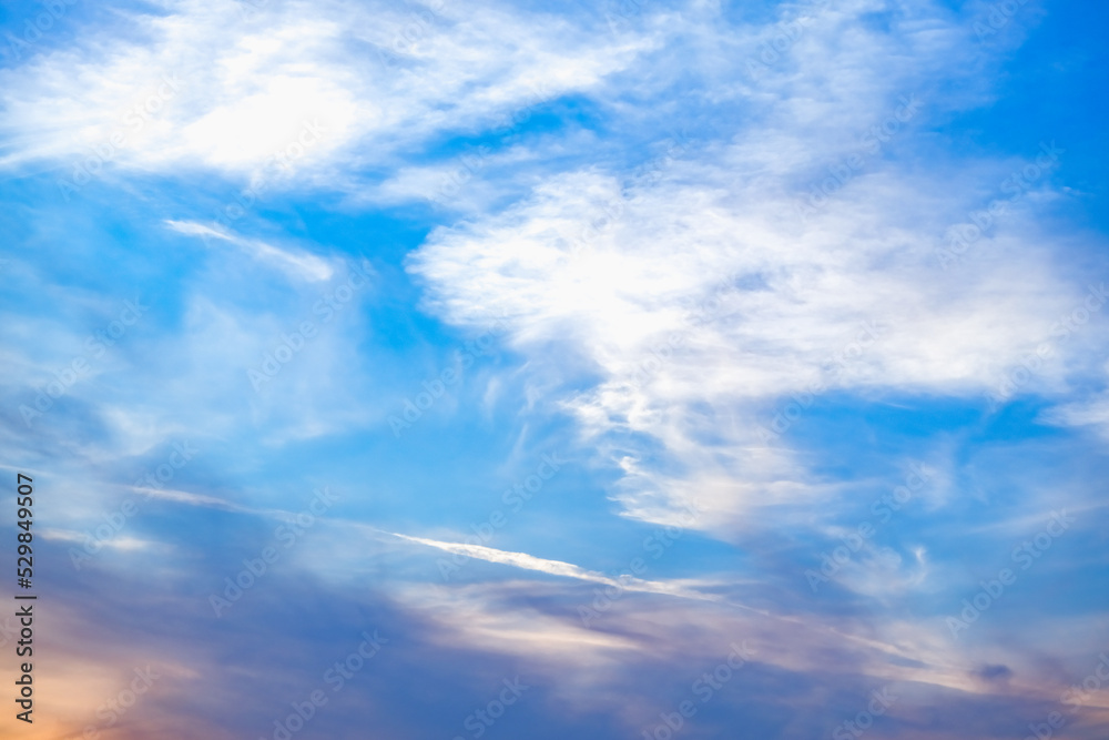 Fototapeta premium Blue sky with white clouds. Beautiful cloudy sky. Skyward. Endless skyline. The sky at dawn.