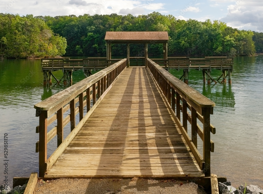 Fototapeta premium Empty fishing pier on mountain lake.