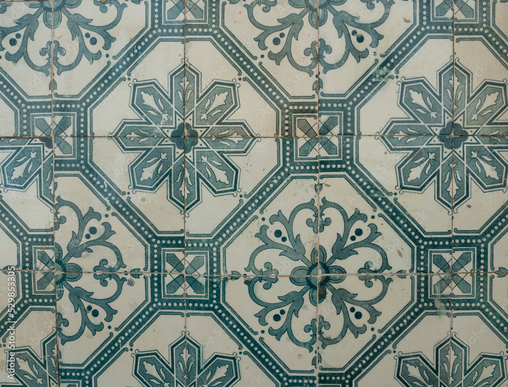 Green ceramic tiles from facade of old houses in Lisbon Portugal. Portuguese traditional Azulejos decorative artistic design background, creative texture surface