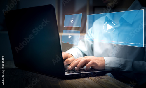 Hands of man using laptop to stream Watch videos