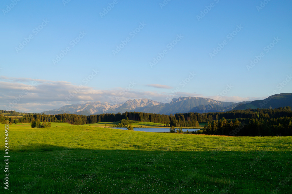 hiking trail overlooking scenic Attlesee and the lush green alpine meadows in the Bavarian Alps, Nesselwang, Allgaeu or Allgau, Germany
hiking trail overlooking scenic Attlesee and the lush green alpine meadows in the Bavarian Alps, Nesselwang, Allgaeu or Allgau, Germany