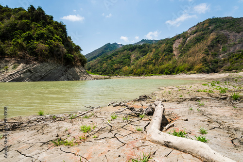 Dry lake bed with the natural texture of cracked clay on the land of Nanhua Reservoir in Tainan, Taiwan. 