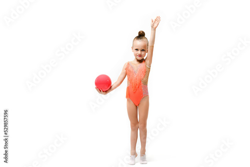 Small artistic gymnast girl with rubber ball photo