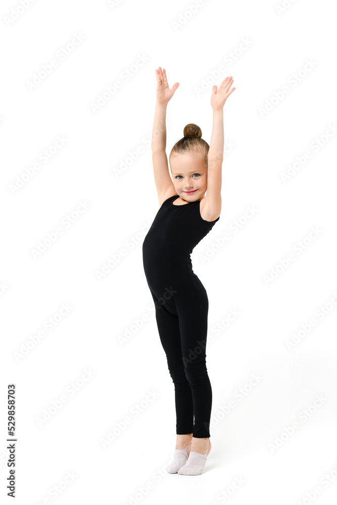 Lovely small gymnast girl in black leotard