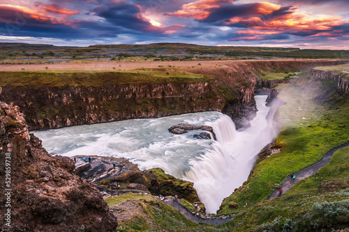 Fototapeta Naklejka Na Ścianę i Meble -  Majestic Gullfos waterfall with picturesque sky during sunset. Amazing nature scenery. Scenic Image of Iceland. Iceland is iconic country for landscape photographers. popular travel destination