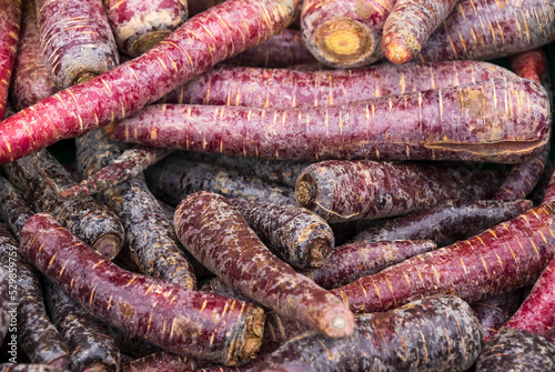 carrots with red color on a market stall