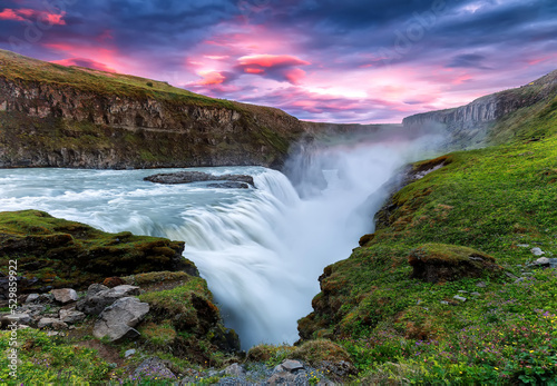 Powerfull Gullfoss waterfall in Iceland during sunset. Amazing Iceland nature landscape. popular tourist attraction. Iceland is iconic country for landscape photographers. Scenic Image of Iceland