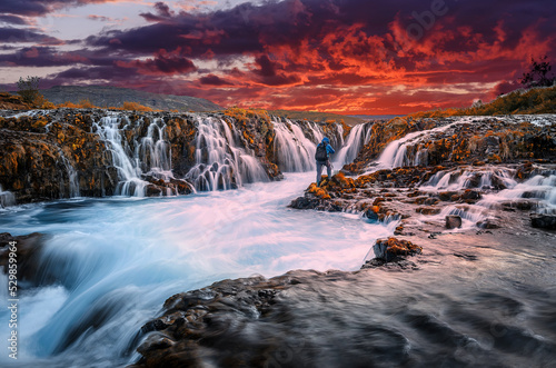 Scenic image of Iceland. Fantastic colorful sunset over the Bruarfoss Waterfall with picturesque sky. Wonderful Nature landscape. Iceland popular place of travel and touristic location. © jenyateua