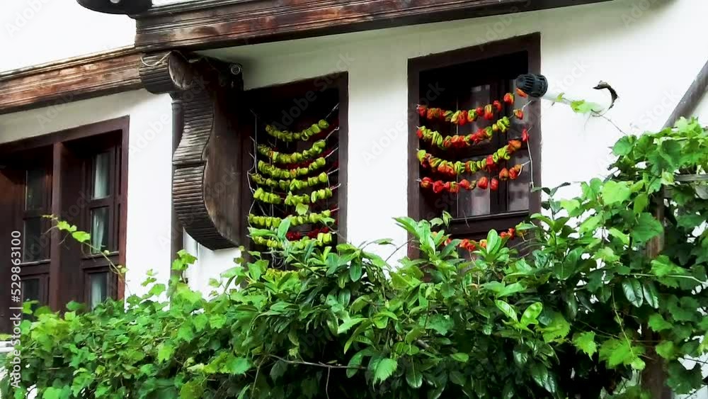 dried bell peppers in the window of the old house dried bell peppers in the window of the old house