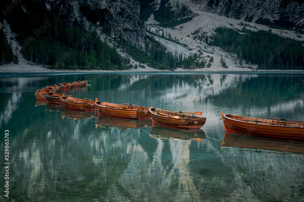 Boats on the Braies Lake Pragser Wildsee in Dolomites mountains, Sudtirol, Italy