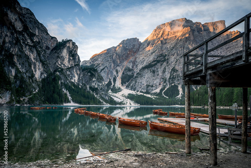 Boats on the Braies Lake Pragser Wildsee in Dolomites mountains, Sudtirol, Italy