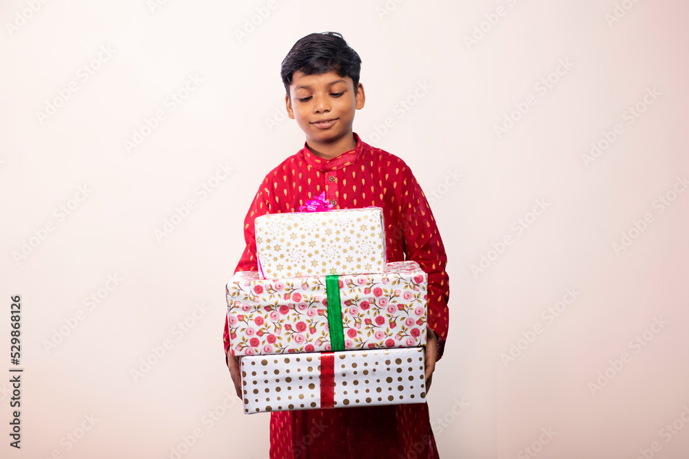 Boy holding a gift on Diwali Boy holding a gift on Diwali