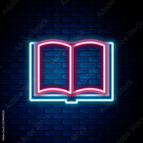 Glowing neon line Open book icon isolated on brick wall background. Colorful outline concept. Vector