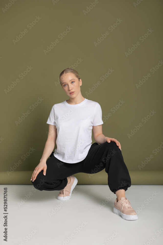 Attractive blonde woman in white t-shirt. Mock-up.