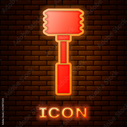 Glowing neon Kitchen hammer icon isolated on brick wall background. Meat hammer. Vector