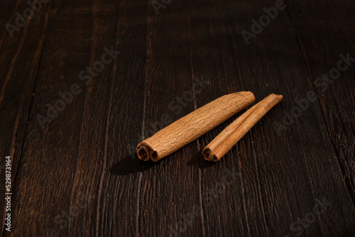 Cinnamon close up on wooden background