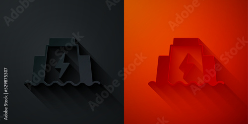 Paper cut Hydroelectric dam icon isolated on black and red background. Water energy plant. Hydropower. Hydroelectricity. Paper art style. Vector