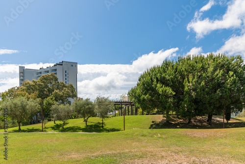 Garden of Troia covered with green trees andmodern buildings, Grandola municipality, Portugal photo