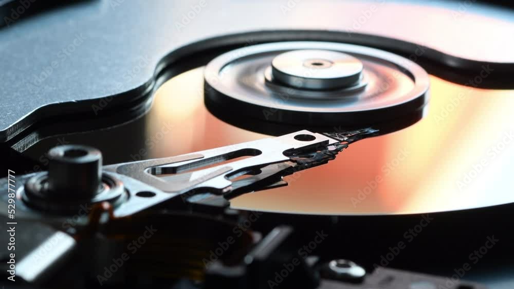 Hard Disk Drive, Close up of a hard disk drive reading and writing data Hard Disk Drive, Close up of a hard disk drive reading and writing data