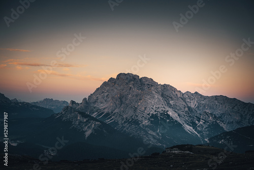 The mountains of the Cadini Group at sunrise at the Drei Zinnen Hütte in the Dolomites in South Tyrol, Italy.