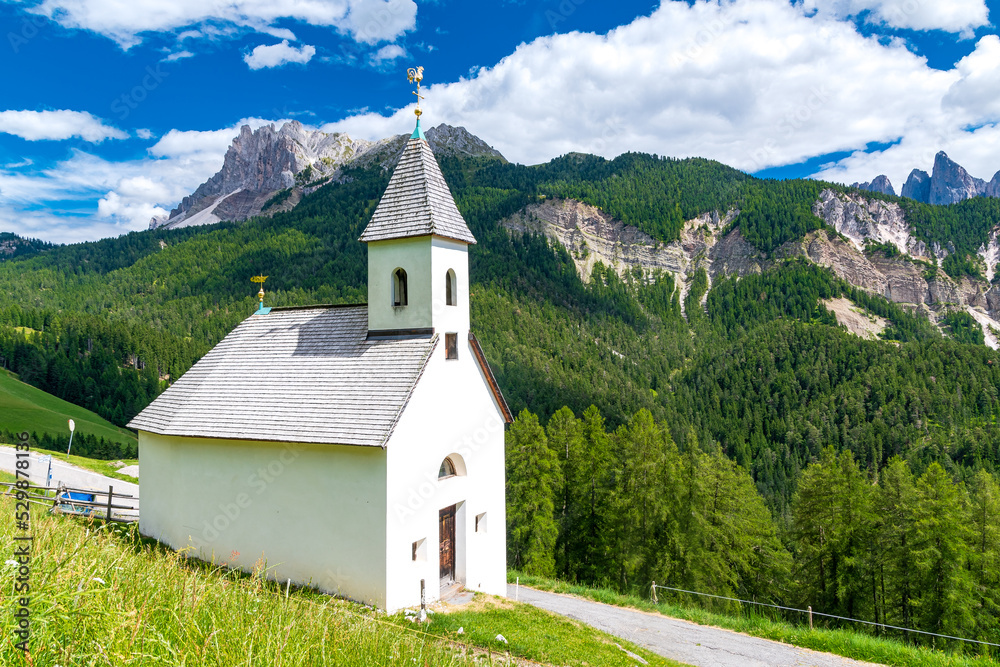 Small chapel near Villnöß (Funes) with alpine mountains in South Tyrol in northern Italy