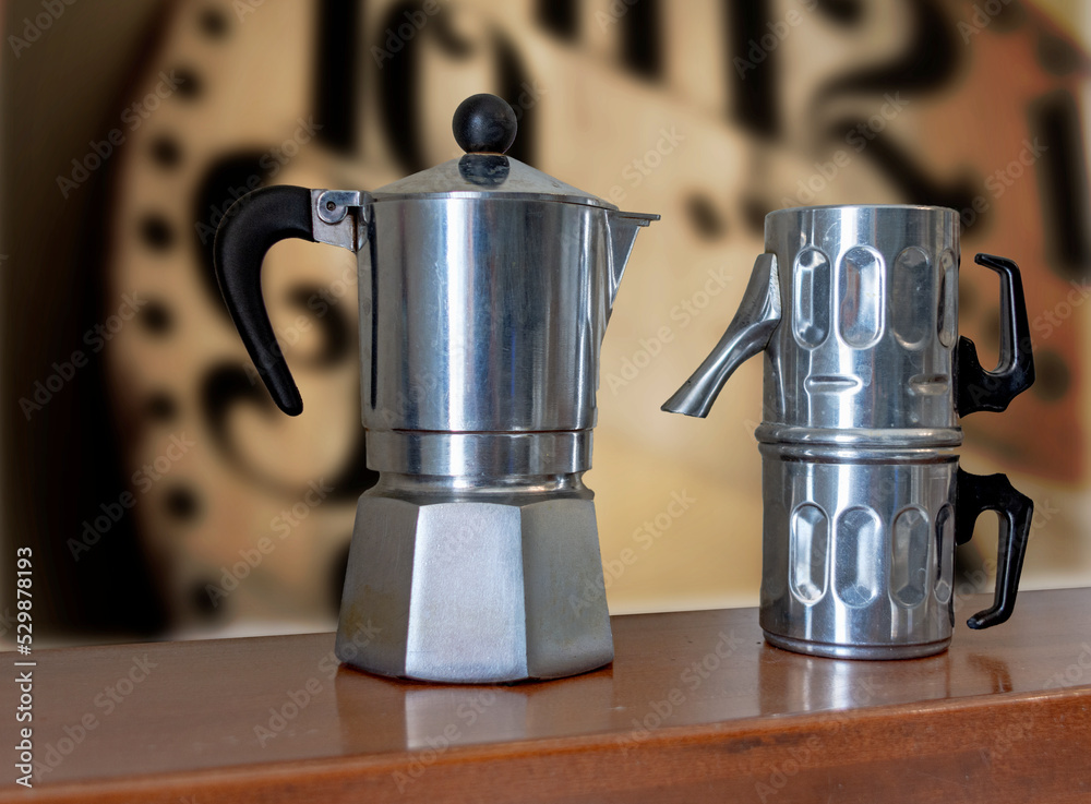 Two classic Italian home coffee machines. Classic Moka maker and Neapolitan coffee maker. Two classic Italian home coffee machines. Classic Moka maker and Neapolitan coffee maker.