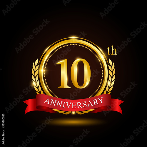 10th golden anniversary template design, with shiny ring and red ribbon, laurel wreath isolated on black background, logo vector01