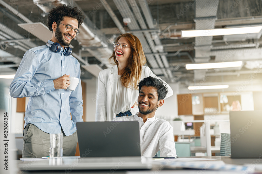 Diverse group of colleagues enjoying working together in an office. Teamwork concept Diverse group of colleagues enjoying working together in an office. Teamwork concept