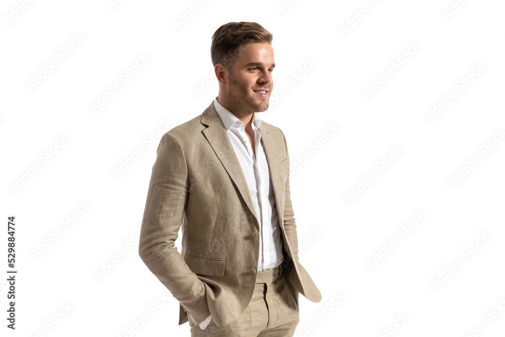 portrait of happy businessman looking to side and smiling portrait of happy businessman looking to side and smiling