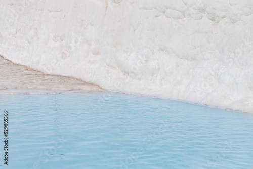 Natural travertine pools pool blue water and terraces in Pamukkale Turkey
