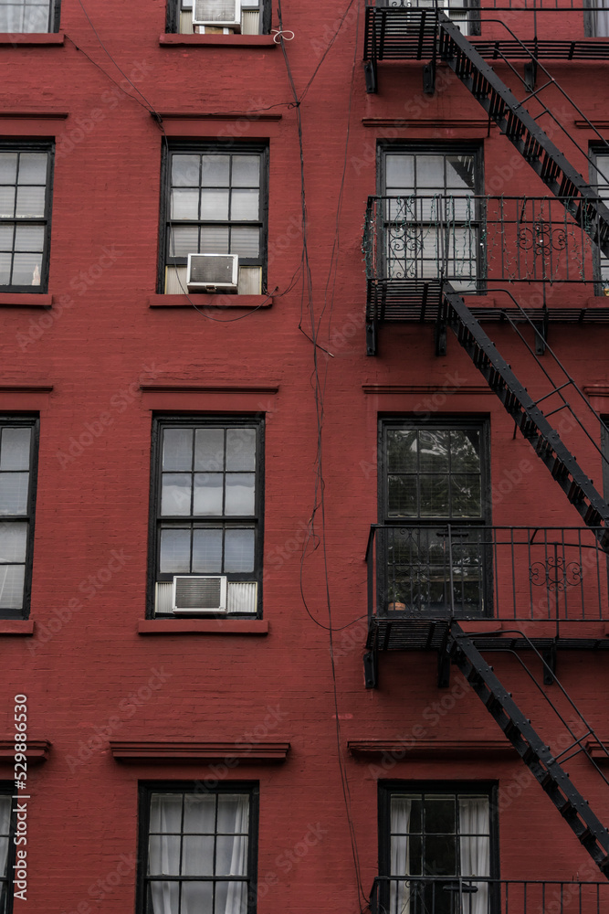Old New York apartment building with fancy terra cotta detailing Manhattan Lower East Side apartment building with external fire ladders Old New York apartment building with fancy terra cotta detailing Manhattan Lower East Side apartment building with external fire ladders