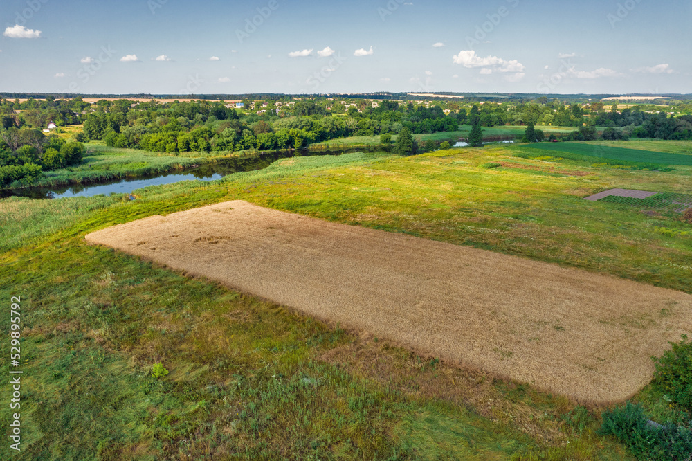 Obraz premium Drone view over summer sunset river Ros landscape, Ukraine.