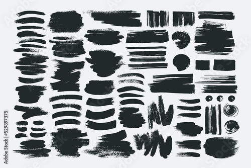 Big set of black ink shapes. Hand drawn blackgrunge torn box shapes with rough edges on dark background. Glitter paint stroke  distressed black brush strokes